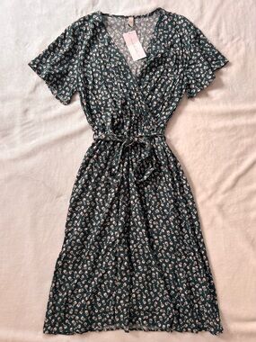 One Loved Babe world travellers dress green floral